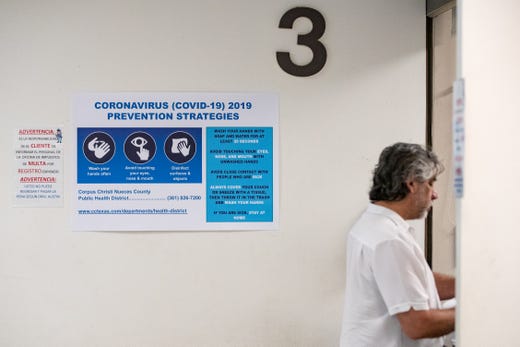 Coronavirus prevention signs inside the Nueces County Courthouse on Friday, March 13, 2020.