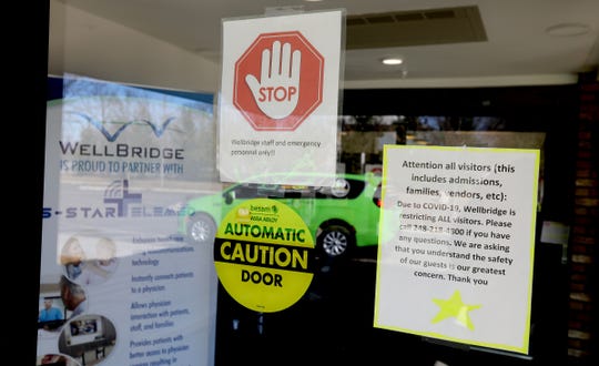 Signs out front telling visitors On usual days the parking lot at WellBridge of Rochester Hills, a skilled nursing and rehabilitation center in Rochester Hills, Michigan is full of cars of visitors inside seeing their loved ones.
On Friday, March 13, 2020 the parking lot is empty and has been since the center has closed off to visitors due to the Coronavirus Covid-19 on Tuesday.
