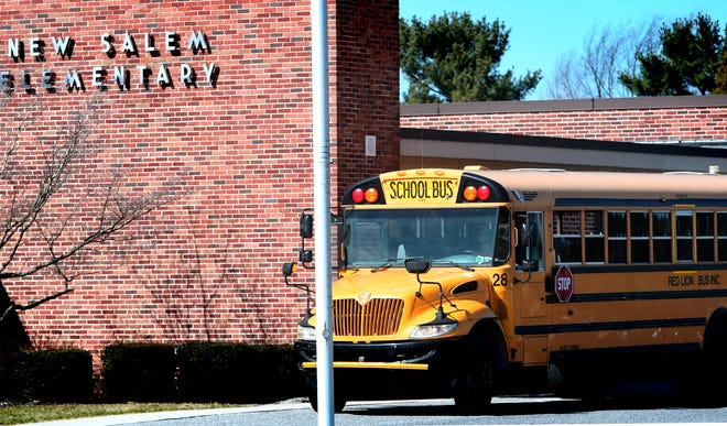 A bus awaits students at New Salem Elementary School at the end of the school day Friday, March 13, 2020. That was the last day of classes before Gov. Tom Wolf ordered Pennsylvania schools closed in an effort to contain the COVID-19 virus. York County school districts now are grappling with estimated losses of between $1 million and $3 million in local revenue for the 2020-21 school year.