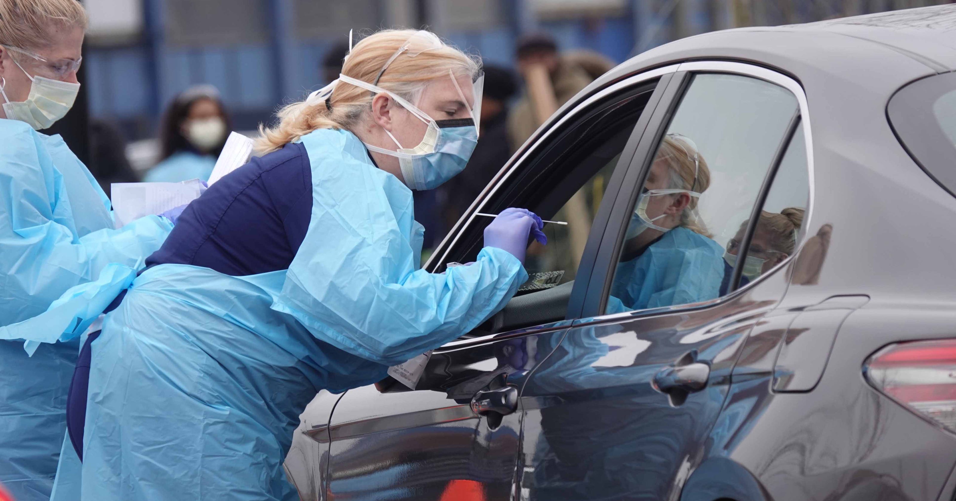Long line of cars waits for drivethru coronavirus testing