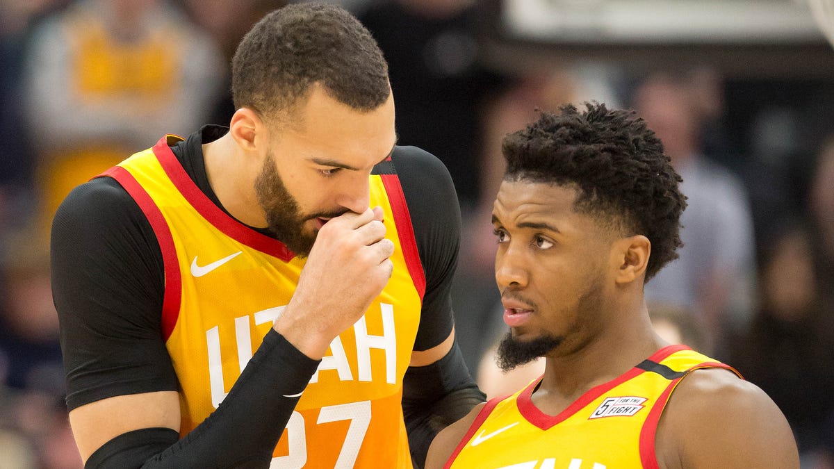 Utah Jazz center Rudy Gobert (left) and guard Donovan Mitchell tested positive for the coronavirus, leading the NBA to shut down indefinitely.