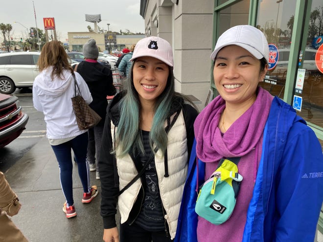 Jolene and Christine Chan wait in line at a Costco in Lawndale, California