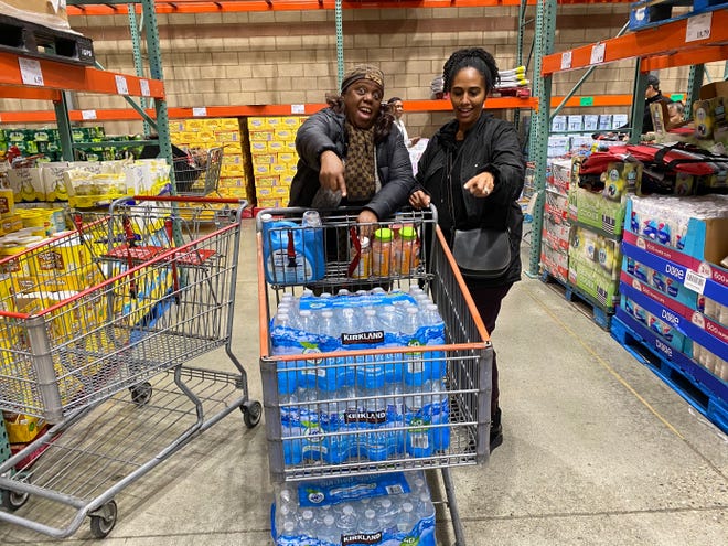 Chiquita Thursby and Yordano Tesfailasce waited one hour to get their allotted two cases of water at a Costco in California