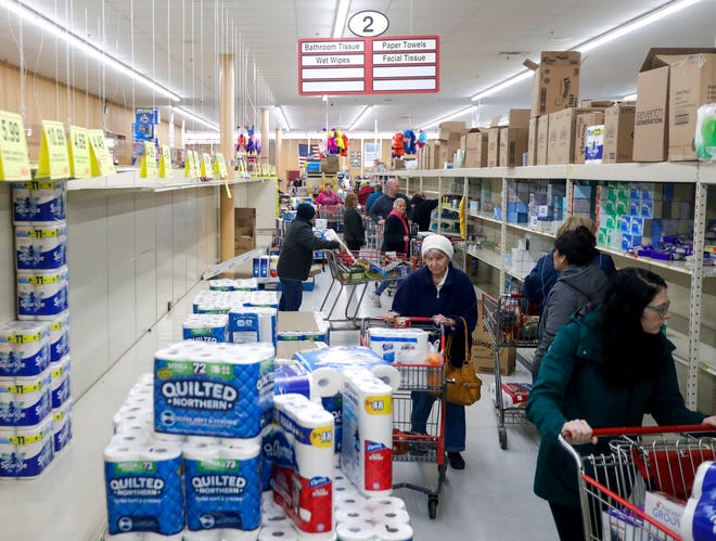 Shoppers quickly emptied shelves of toilet paper and other household items up on household items the day after President Donald Trump announced a national state of emergency due to the spread of the new coronavirus and its economic fallout. Stores have struggled to keep items in stock since then