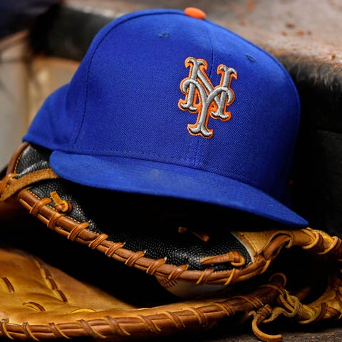 A general view of a New York Mets hat and glove.