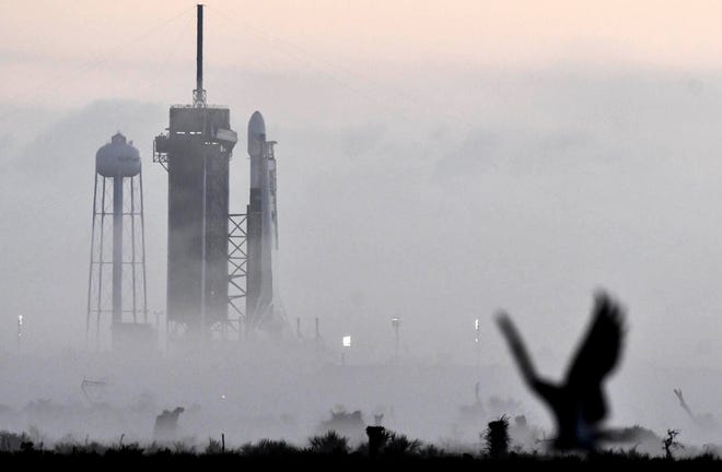 Kennedy Space Center's pad 39A and a SpaceX Falcon 9 rocket are partially obscured by early morning fog on Sunday, March 15, 2020. The launch attempt was scrubbed due to engine issues.