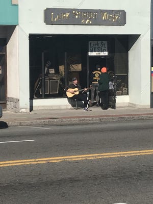 The scene outside vintage guitar shop, Lark Street Music
