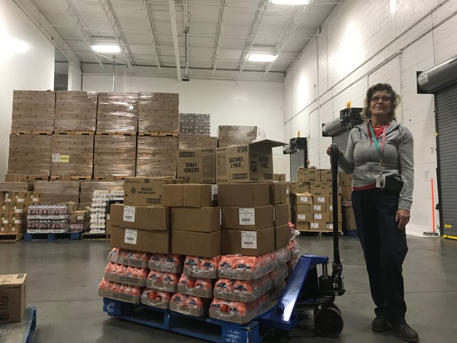 A Food Bank of South Jersey team member works in the Pennsauken warehouse.