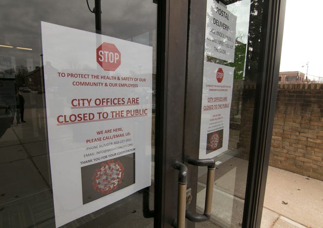 Brighton City Hall personnel posted a sign indicating its closure Monday, March 16, 2020 due to the coronavirus.