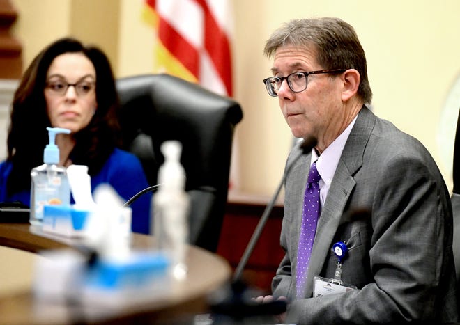 York County President Commissioner Julie Wheeler listens as John Porter, executive vice president and COO of WellSpan Health, speaks during a press conference at the commissioner's chambers Monday, March 16, 2020. Wheeler declared a state of emergency in the county due to the Coronavirus. Bill Kalina photo
