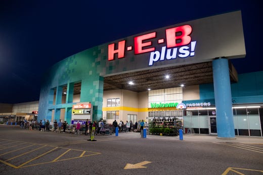 People wait in line at the HEB in Flour Bluff for the store to open at 8am on Tuesday, March 17, 2020. HEB has changed their store hours to 8:00 a.m. to 8:00 p.m to restock shelves due to people stocking up on supplies because of the COVID-19 outbreak.