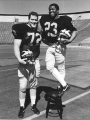 University of Michigan offensive lineman John 'Jumbo' Elliott and running back Jamie Morris.