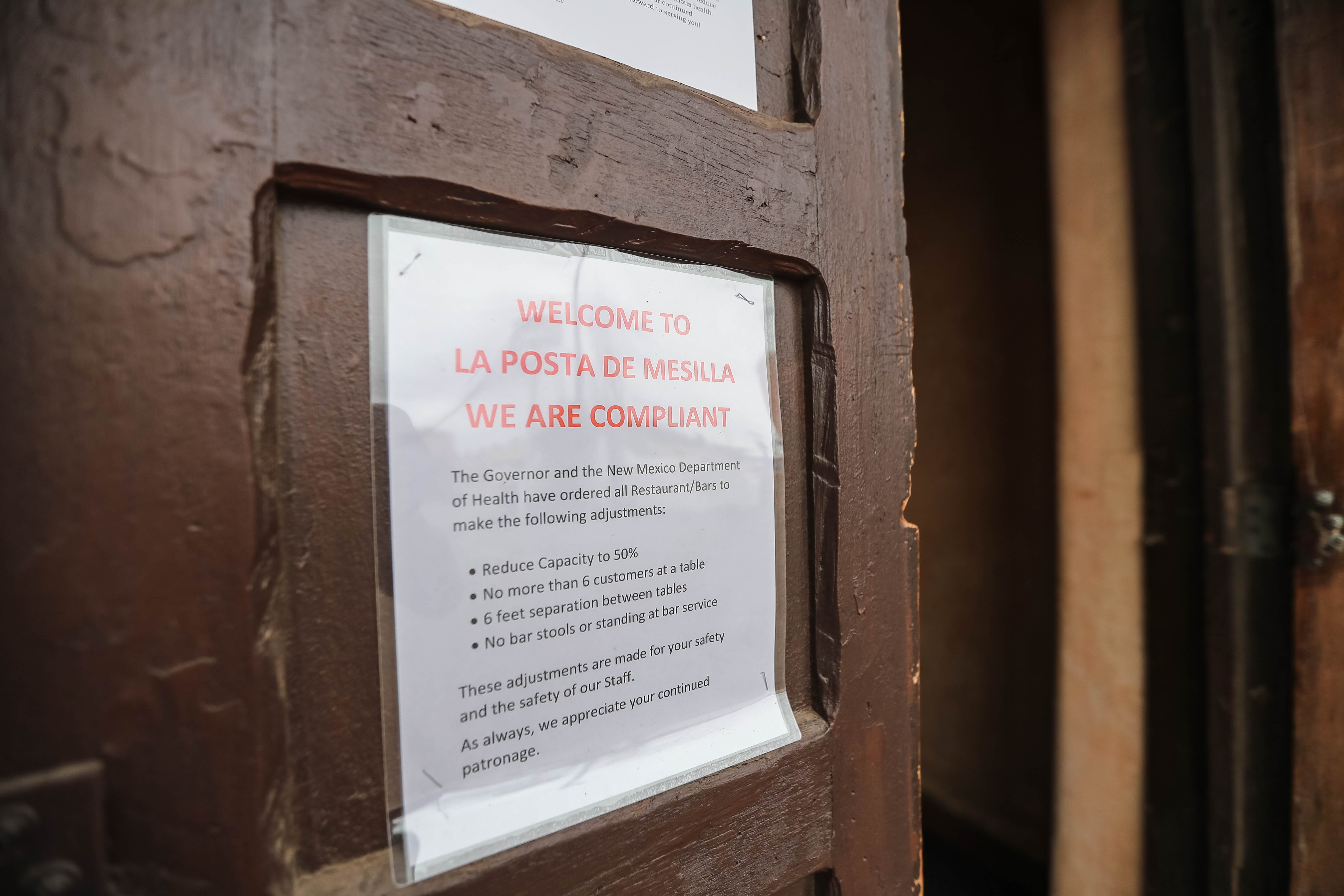 La Posta de Mesilla is pictured during the lunch rush in Mesilla on Tuesday, March 17, 2020. A sign on the door states the restaurant is complying with directives from the New Mexico Department of Health.