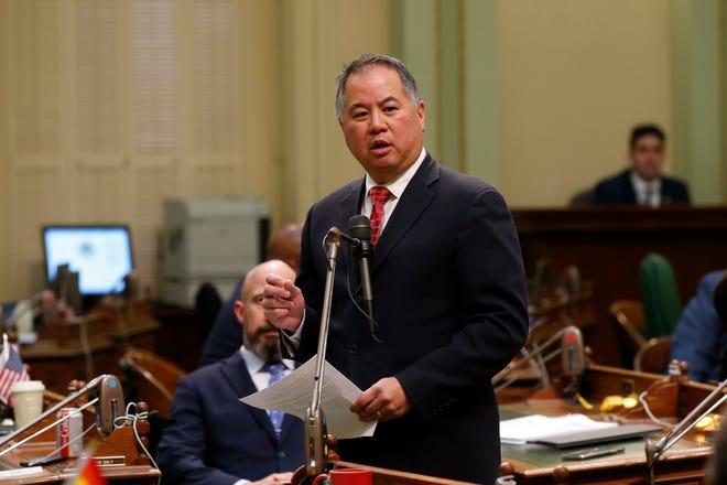 Assemblyman Phil Ting, D-San Francisco, urges lawmakers to approve legislation to provide up to $1 billion in new spending to combat the coronavirus outbreak, at the Capitol in Sacramento, Calif., Monday, March 16, 2020. (AP Photo/Rich Pedroncelli)