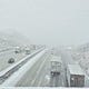 Authorities closed the Grapevine section of Interstate 5 for a time as snow fell on Tejon Pass late Monday afternoon.