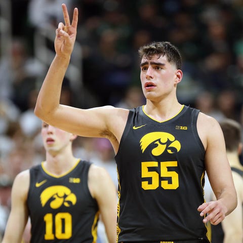 Iowa Hawkeyes center Luka Garza (55) gestures duri