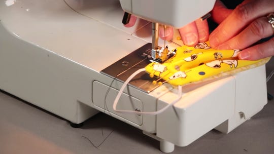 Screenshot from a YouTube video on how to make a medical face mask.