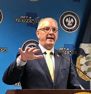 Gov. John Bel Edwards speaks during a March 18 press conference about the coronavirus crisis.