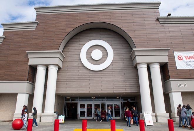 Shoppers enter and exit Target on Saturday, March 14, 2020.