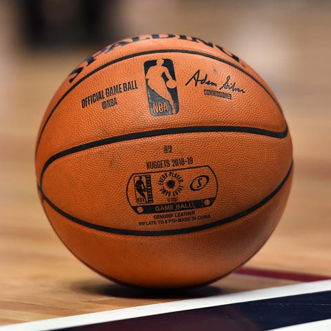 General view of an official NBA game basketball on