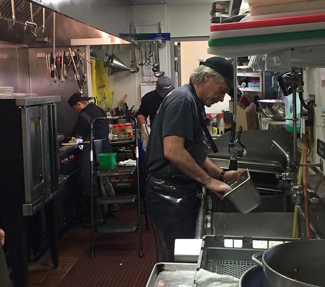 Jon Bon Jovi washing the dishes at Soul Kitchen in Red Bank on March 18, 2020.