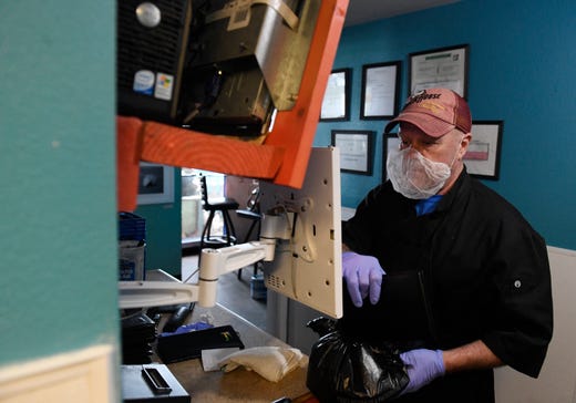 Stores such as the Angry Marlin now only do deliveries and carry out in precaution for the coronavirus, Thursday, March 19, 2020. "The more that people do to reduce their public contact, the sooner the COVID-19 disease will be contained," Abbott said during news conference in his Capitol office on Thursday.