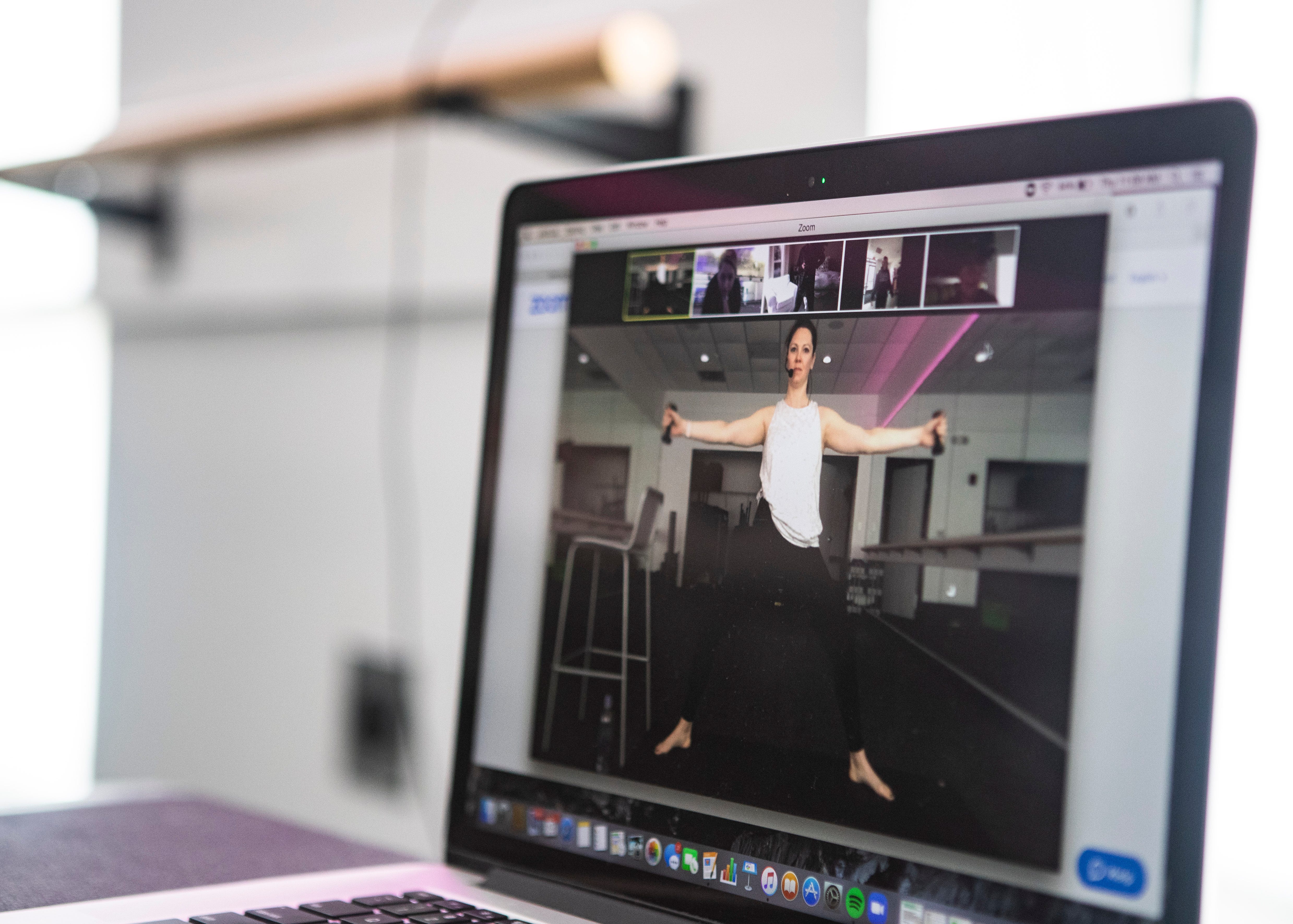 Mary Helen Holman teaches a livestreaming class in response at ZenStudio Fitness on Thursday, March 19, 2020.