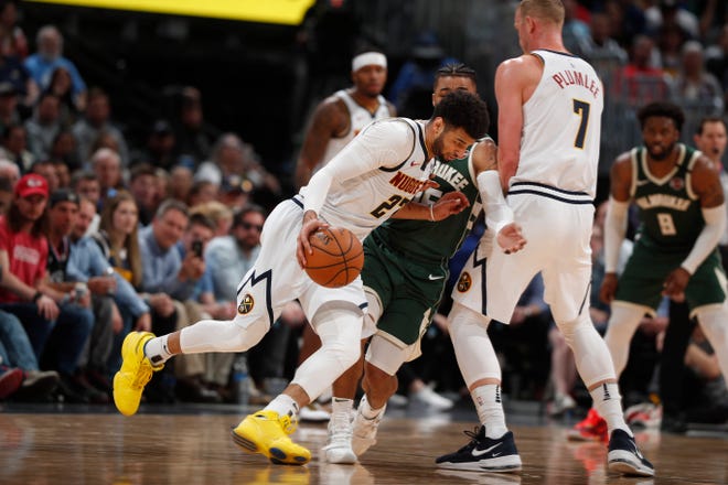 The Bucks' final game before the NBA shutdown was at Denver. On Thursday, the Nuggets announced someone within the organization, although not necessarily a player, has tested positive for coronavirus.