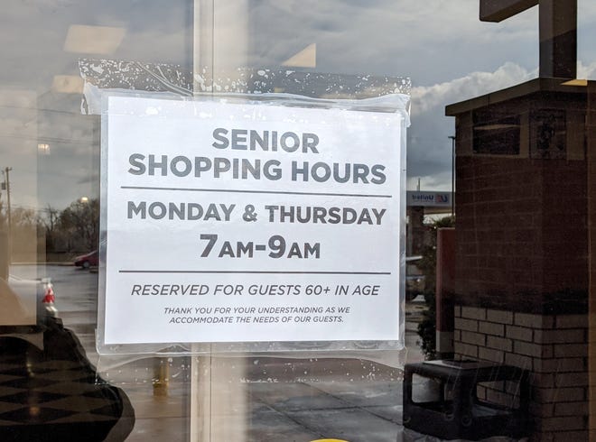 Signs are posted on the doors of United on Old Iowa Park Road showing senior shopping hours Mondays and Thursdays 7 - 9 a.m. amend COVID-19.