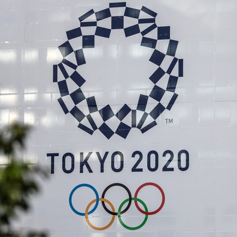 A 2020 Olympics banner is displayed on a building 
