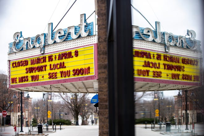 The marquee at the Englert Theatre reads, "Support Local" and "We miss you - see you soon!", Friday, March 20, 2020, in Iowa City, Iowa.