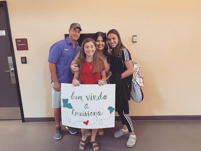 Marina Simoes (right), 16, is an exchange student from Brazil attending Southside High in Youngsville this year. Her host family picked her up from the airport in August with signs welcoming her to Louisiana in Portuguese. With Marina are Whitney, Tabitha and Emma Kate Rogers.
