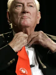 Former UTEP and Texas Western head basketball coach Don Haskins keeps with tradition, first removing his clip-on tie and getting comfortable before speaking to a sold-out crowd at the Don Haskins Center during 