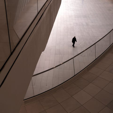A man walks through a nearly empty Oculus transpor