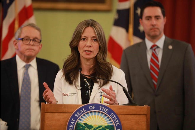 Ohio Department of Health director Dr. Amy Acton at a coronavirus news conference Saturday, March 14, 2020 at the Ohio Statehouse. Behind her is Ohio Gov. Mike DeWine (left) and Secretary of State Frank LaRose.