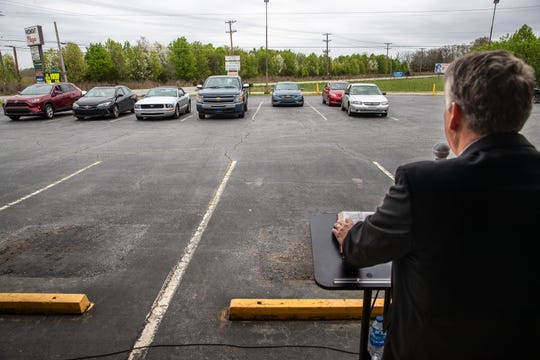 Pastor Rex Simmons, of Living Grace Baptist Church in Piedmont, leads the congregation in a sermon during the church's first service, Sunday, March 22, 2020. In response to the coronavirus outbreak, pastor Rex Simmons decided to have a drive-in style service so congregants could sit in their vehicles.