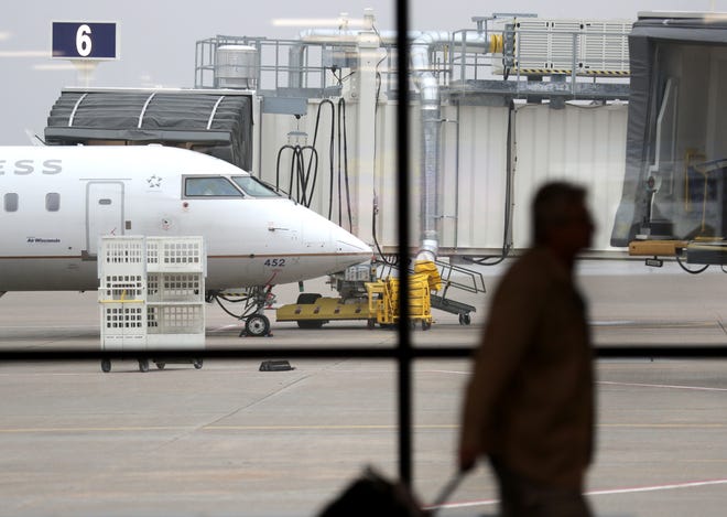 A United Express flight arrives at the Appleton International Airport in Greenville on March 9.