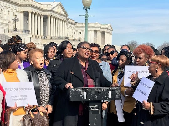 Melanie Campbell, center, president of the National Coalition on Black Civic Participation, talks to a group of Black women March 5 in front of the U.S. Capitol. The women attended a conference focused on the census, voting rights and health care.