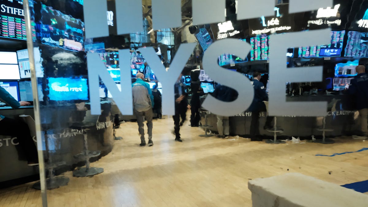 NEW YORK, NEW YORK - MARCH 20: Traders work on the floor of the New York Stock Exchange (NYSE) on March 20, 2020 in New York City. Trading on the floor will temporarily become fully electronic starting on Monday to protect employees from spreading the coronavirus.