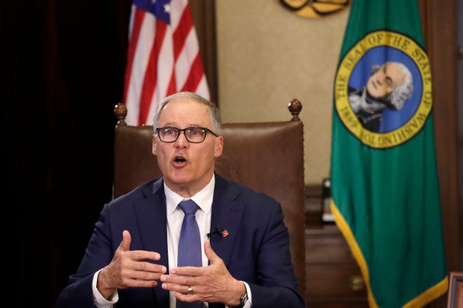 Washington Gov. Jay Inslee before a televised address from his office Monday, March 23, 2020, in Olympia. Inslee broadened restrictions on businesses amid the COVID-19 outbreak on Monday, announcing the closure of "non-essential" business until April 6.