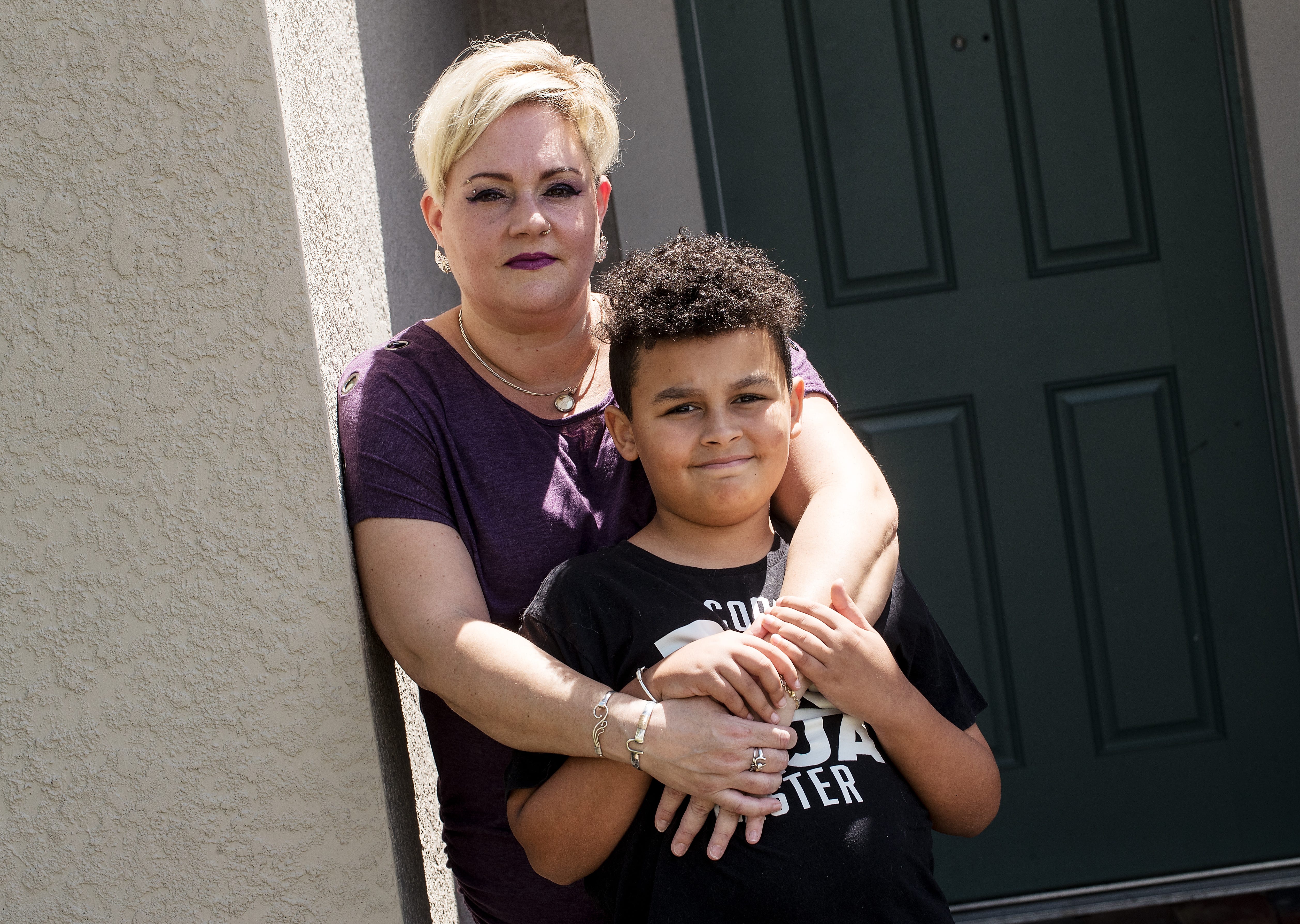 Alva resident Valerie Diaz, a single mother of two, lost her job as a hair stylist at Great Clips because of the coronavirus pandemic. She has been promised her job back when the pandemic ends, but she doesn't know how long it will last. She is pictured with one of her sons, Jerimiah Diaz-Bethea, 10.