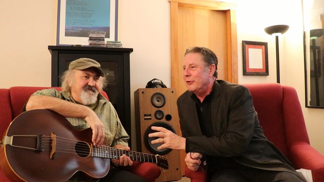 Kostas, left, talks to Bart Herbison about songwriting.