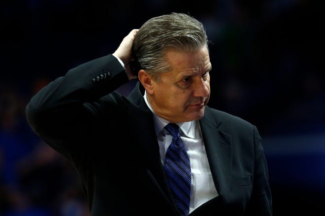 Kentucky coach John Calipari scratches his head late in the second half of the team's NCAA college basketball game against Tennessee, Tuesday, March 3, 2020, in Lexington, Ky. Tennessee won 81-73. (AP Photo/James Crisp).
