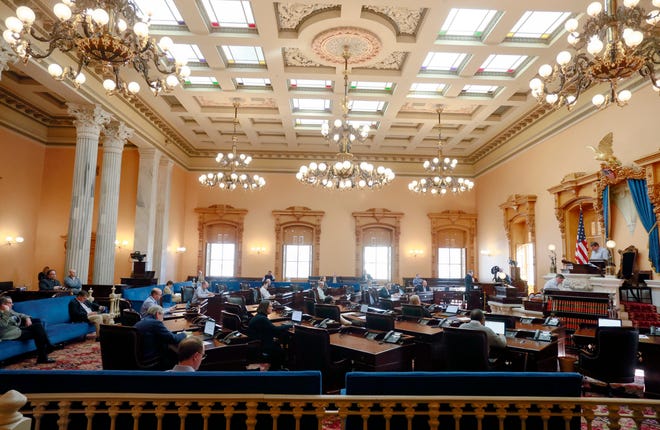 The Ohio Senate was in session at the Ohio Statehouse on Wednesday, March 25, 2020. Sentators took precautions against coronavirus including spacing themselves through the Senate chambers and using hand sanitizer. Some staff members wore gloves.[Barbara J. Perenic/Dispatch]