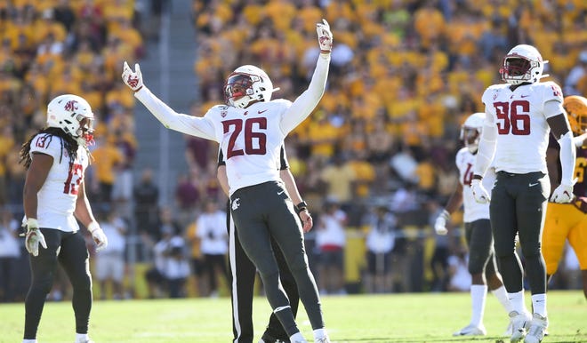 In this Oct. 12, 2019, photo, Washington State defensive back Bryce Beekman (26) reacts after he stopped Arizona State running back A.J. Carter for a one yard loss during the second half of a game at Sun Devil Stadium in Tempe, Ariz.