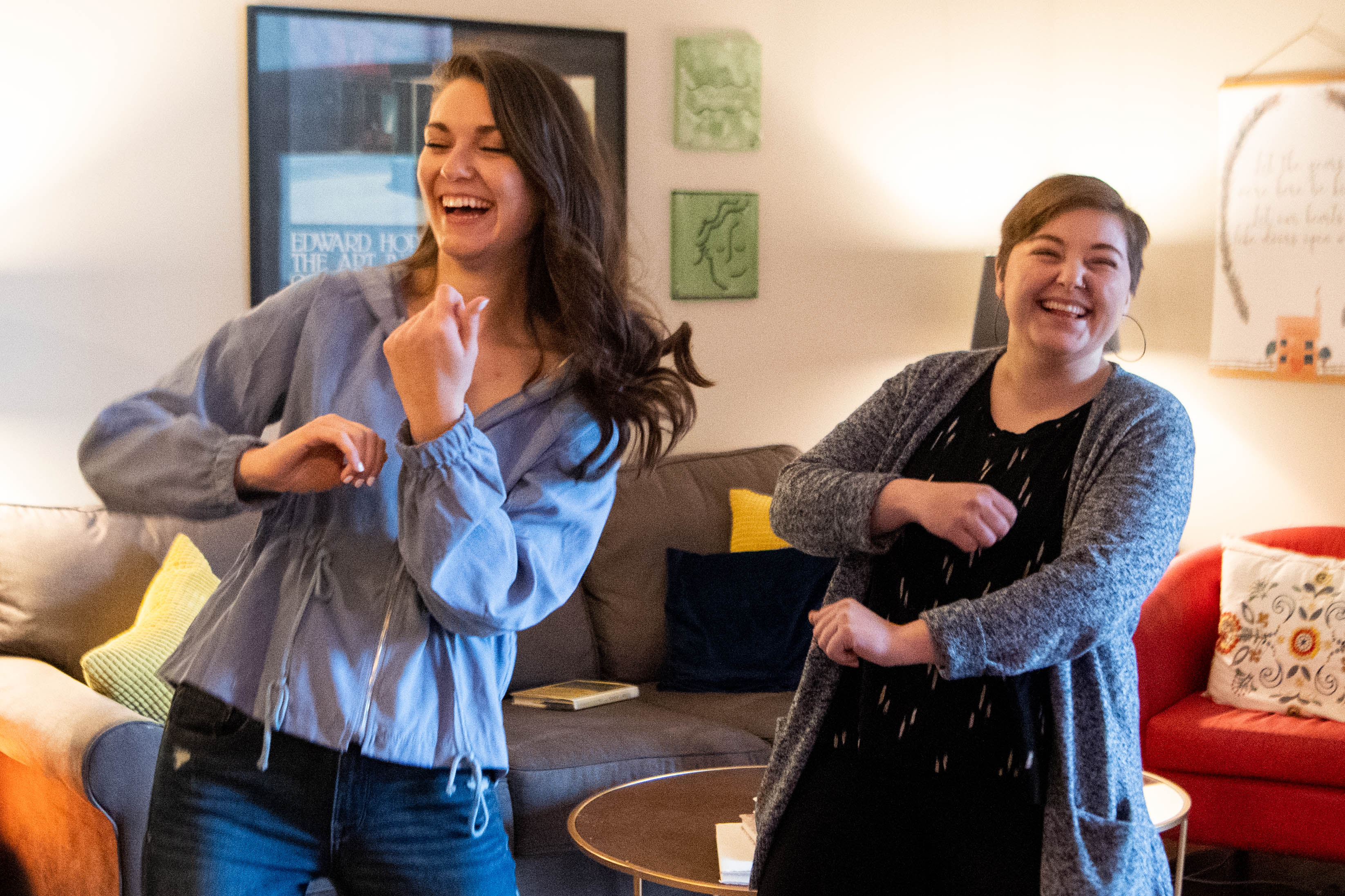 Katie Clinebell, left, and Ellen Wildman record themselves dancing to put on Instagram at their home Tuesday, March 24, 2020, in Brentwood, Tenn.