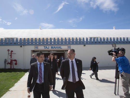 At left, U.S. congressman Raul Ruiz and Riverside County Supervisor V. Manuel Perez walk at the Riverside County Fair & National Date Festival grounds in Indio, California to observe the creation of a 125-bed temporary hospital to be used for COVID-19 patients in the Coachella Valley. 