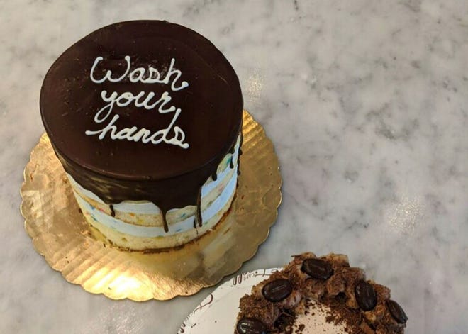 Quarantine cakes decorated with customized sayings are among the baked goods available from Cafe Ficelle in Ventura. The bakery has a new online-ordering system in place in response to the COVID-19 crisis.