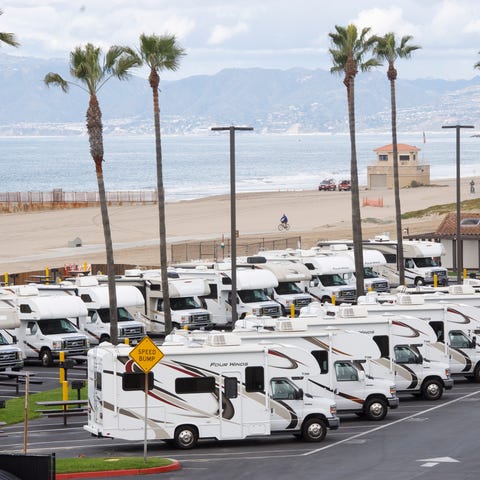 Vehicles stand ready at temporary housing for pers