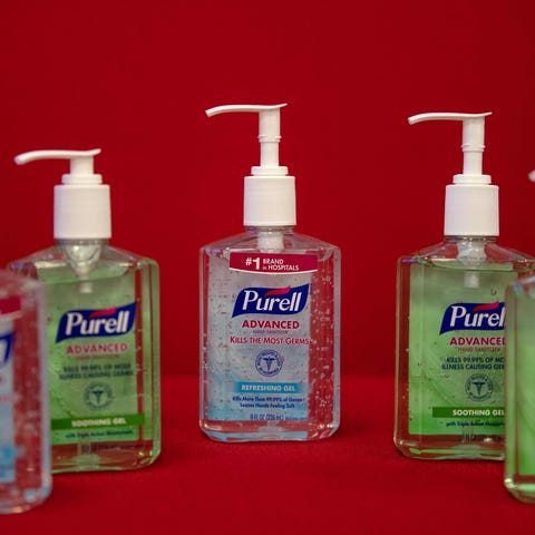This photo illustration shows bottles of Purell ha
